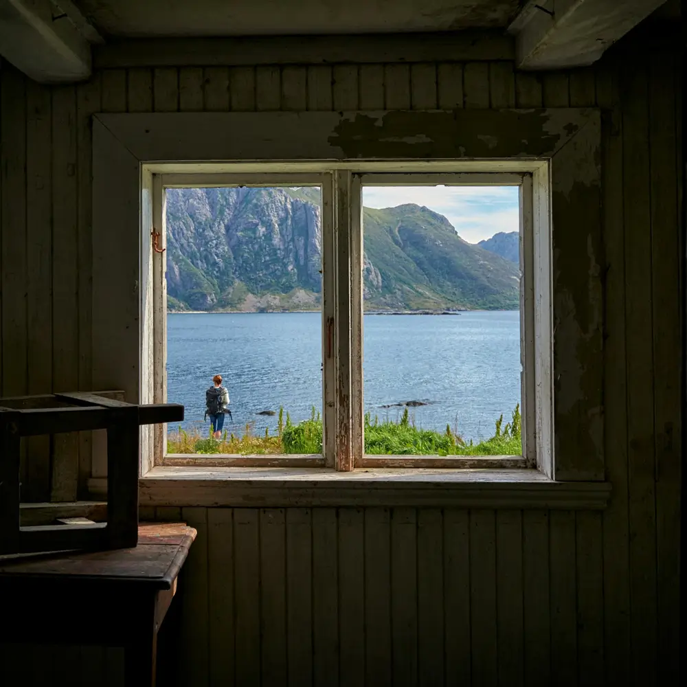 A window with someone standing outside